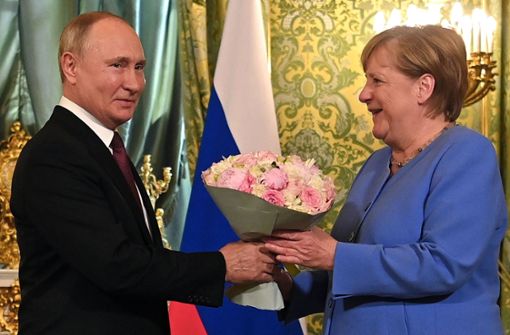 Russlands Präsident Wladimir Putin und Bundeskanzlerin  Angela Merkel. Foto: AFP/EVGENY ODINOKOV