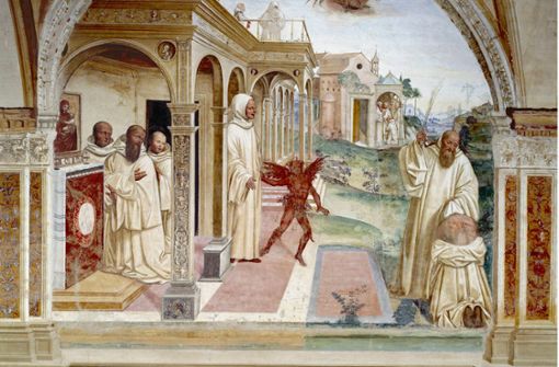 Der heilige Benedikt (rechts) schlägt einen  Besessenen und befreit ihn so  vom Teufel –  Malerei in der Abtei von Monte Oliveto Maggiore in  der Toskana. Foto: imago/Leemage/imago stock&people